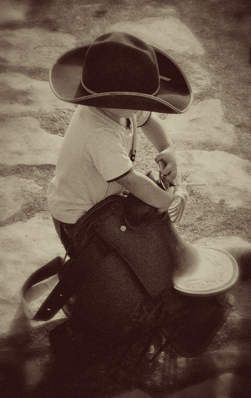 Little Man Packin’ his Saddle