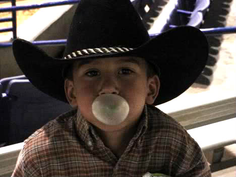 Toby chewing bubble gum at the rodeo!